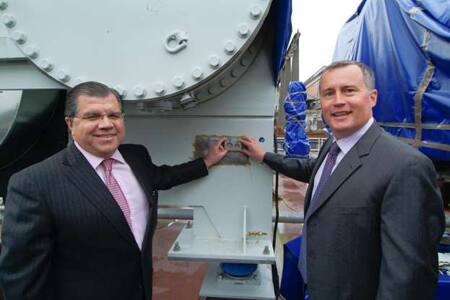 Frank Del Rio, Chairman & CEO of Prestige Cruise Holdings and Bob Binder, President of Oceania Cruises,
with the <em>Marina’s</em> lucky coins.