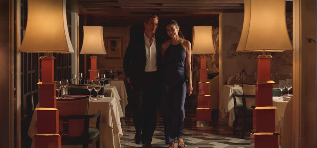 Couple on board Oceania Allura enjoying included specialty dining.