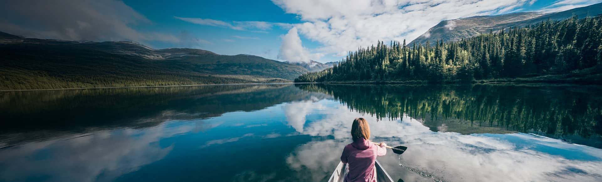 Cruises to Alaska, woman kayaking in a national park