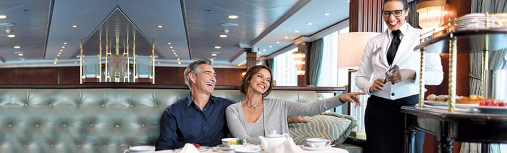 Couple enjoying afternoon tea on board Insignia
