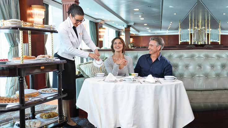 Couple enjoying afternoon tea on board Insignia