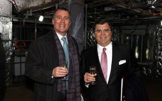 Bob Binder and Frank Del Rio enjoy the first toast onboard Marina.