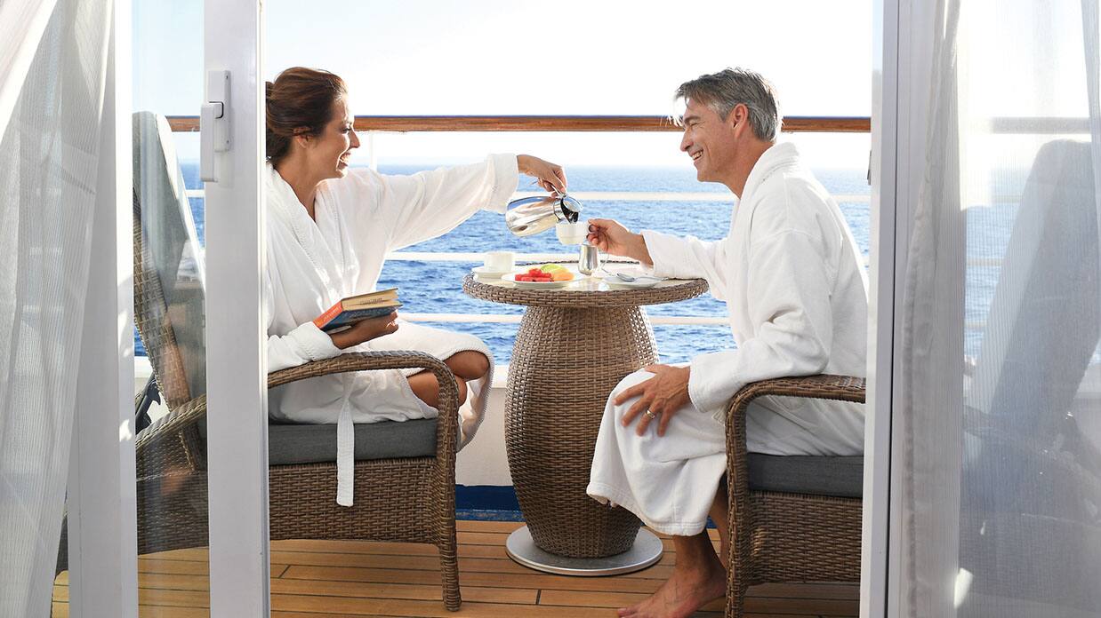 couple on balcony veranda, oceania cruises