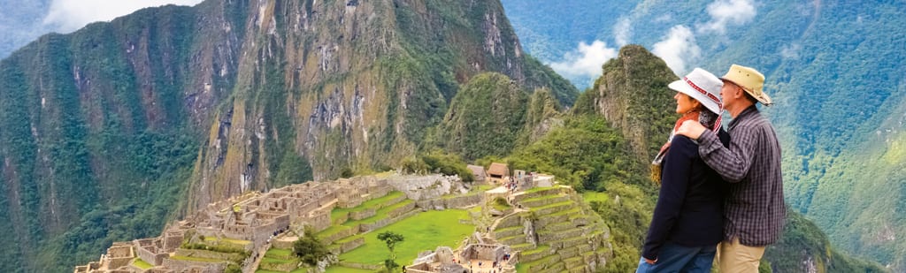 Couple ovelooking Machu Picchu in Peru