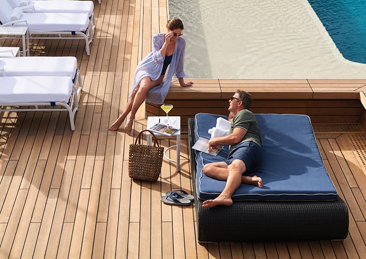 Couple on Pool Deck on Oceania Cruises. Up to 50% Off plus $250 Shipboard Credit