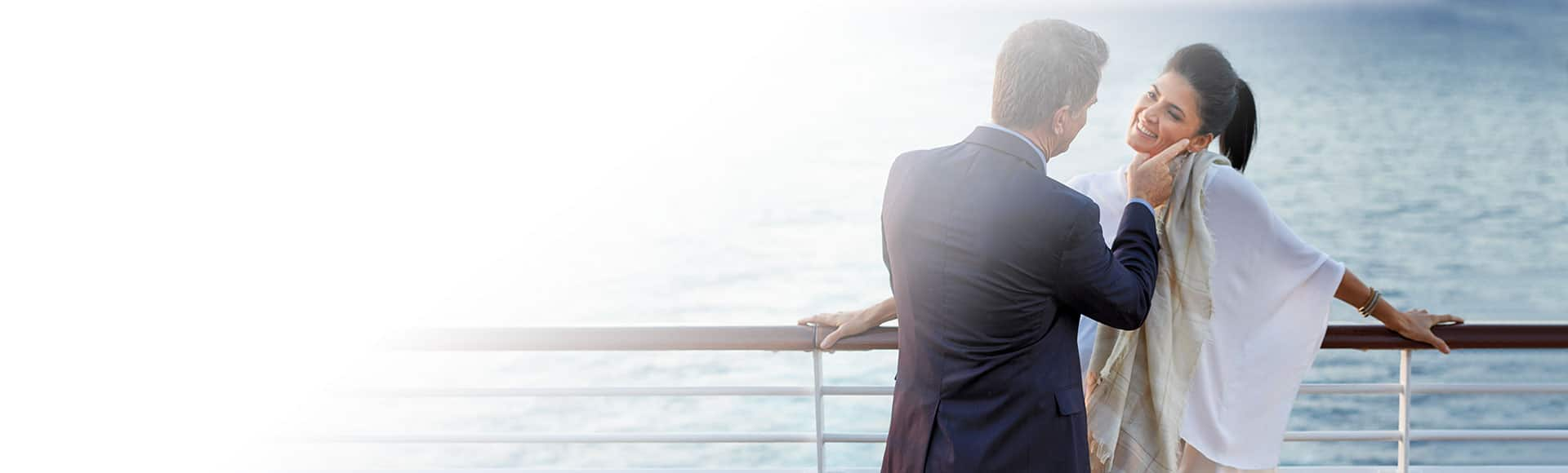 Couple enjoying sunset on terrace on board Nautica