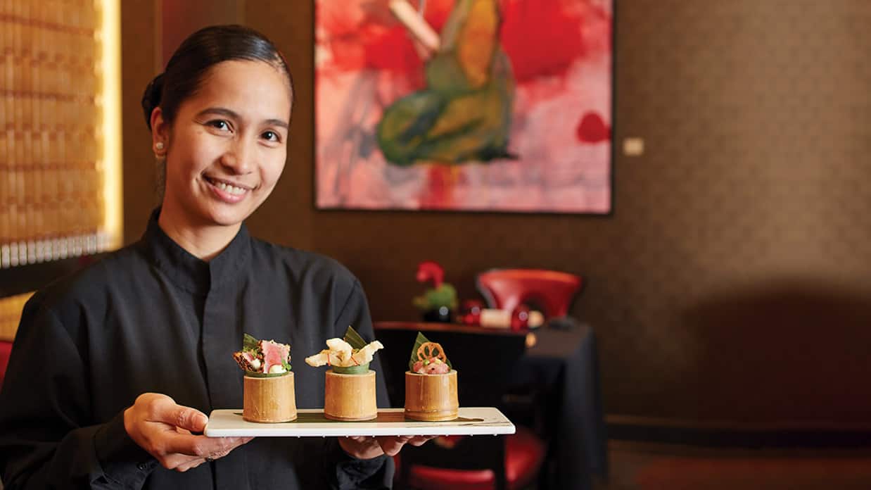 Waitress Serving at Marinas' Red Ginger Asian Cuisine