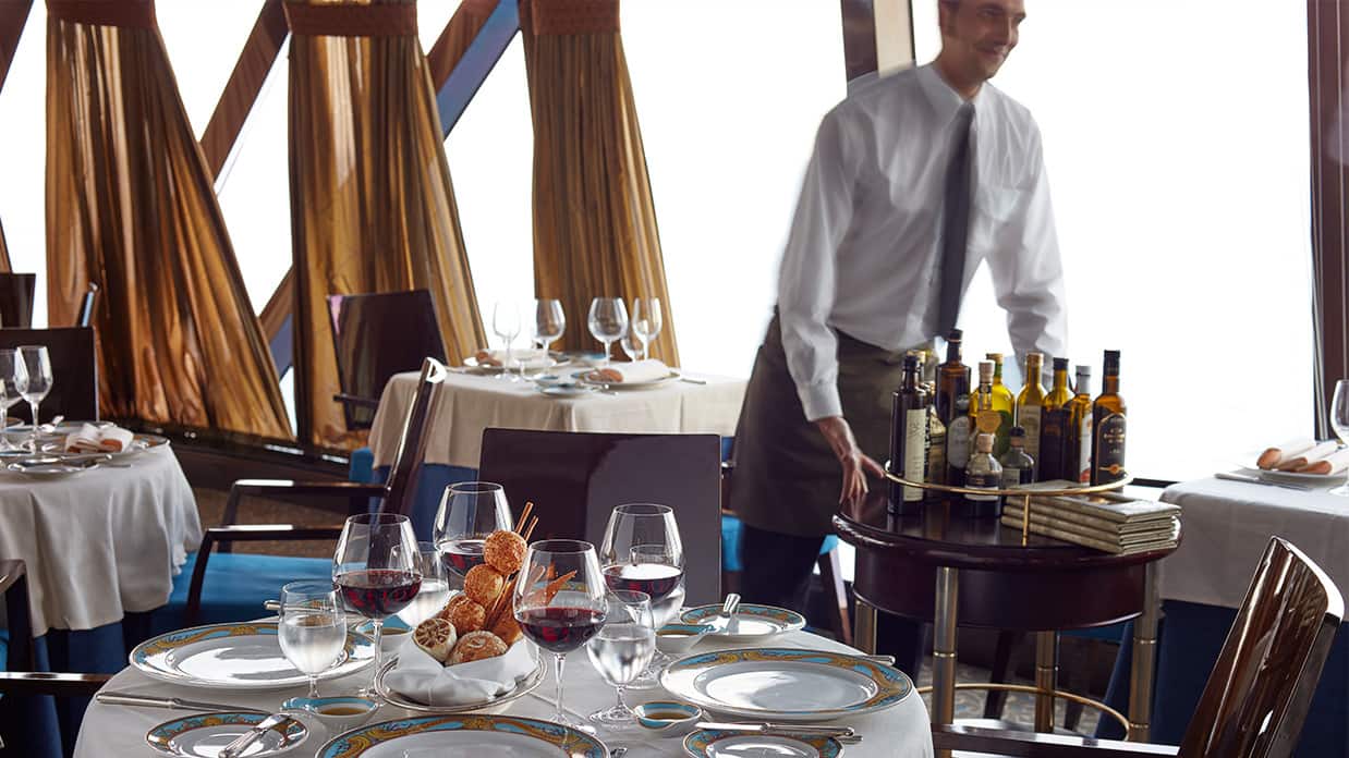 Waiter Preparing Tables At Toscana Italian Ristorante On Board Marina
