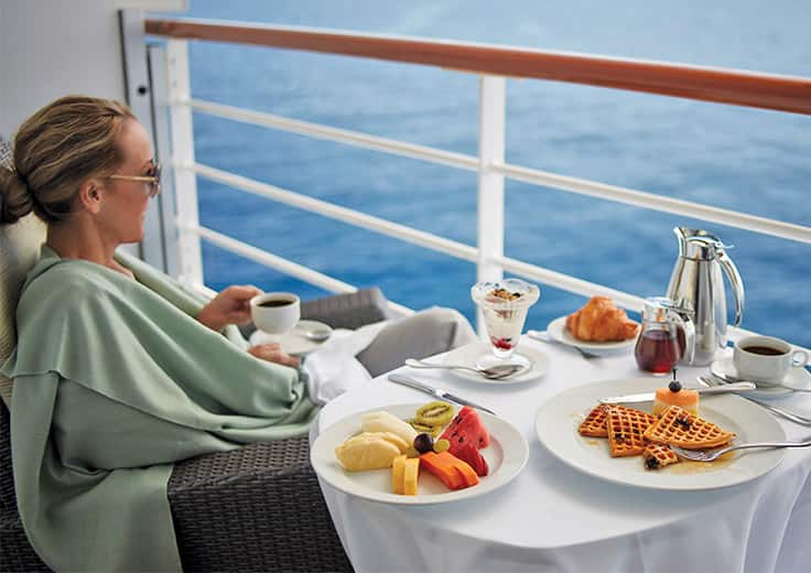 Lady enjoying ocean view on board Riviera