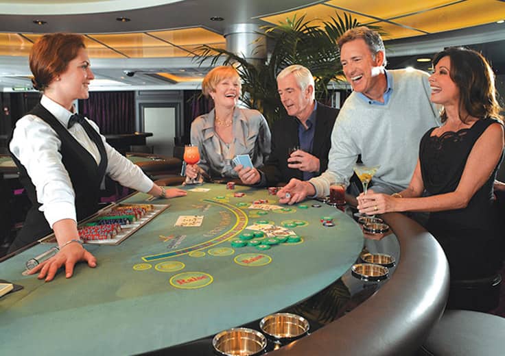 Couples playing blackjack in Riviera's casino