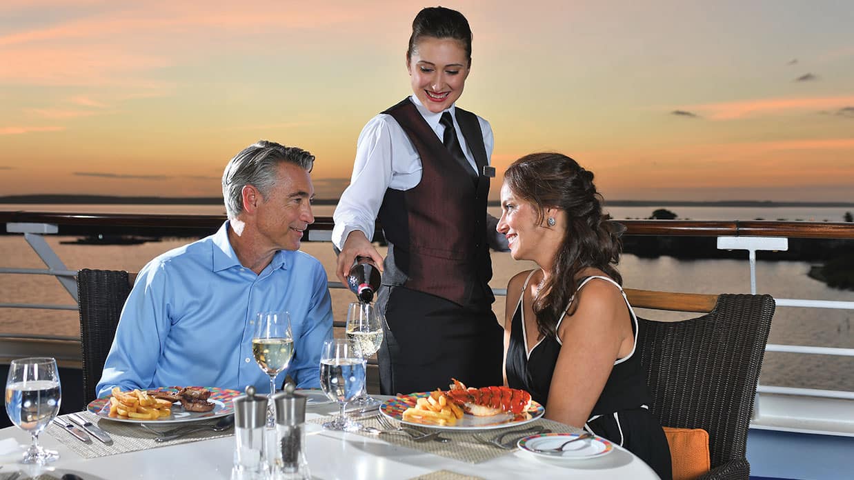 Couple enjoying sunset on board Sirena's Terrace Café