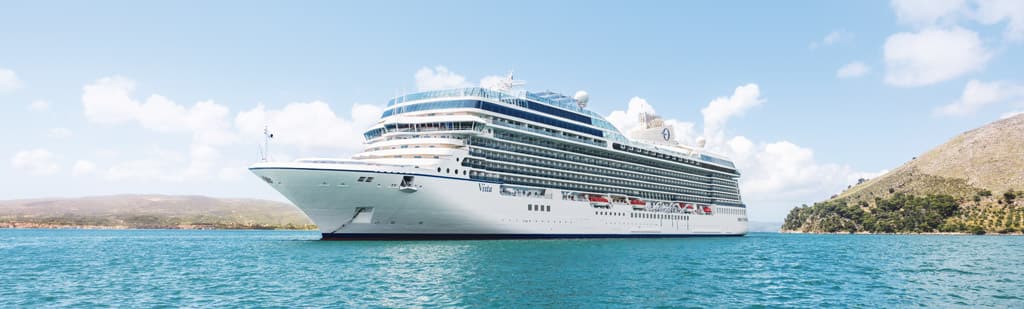 Vista cruise ship visits a sea port from itinerary.