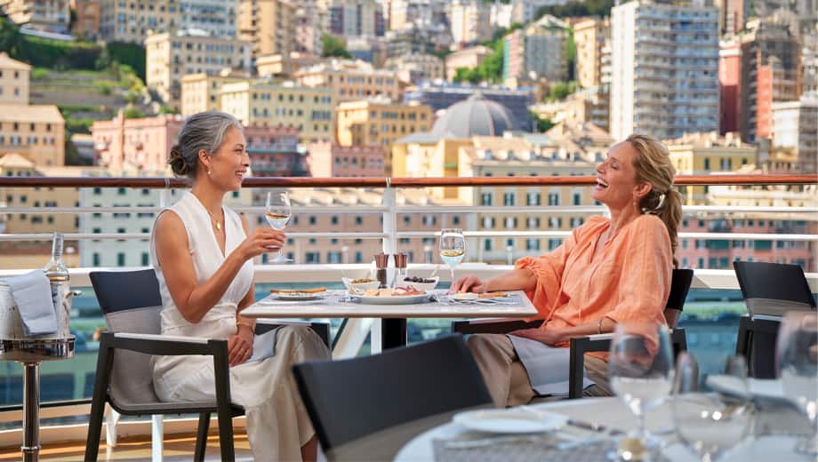 Complementary Wine & Beer on Oceania Cruises. Ladies having wine at lunch at Terrace Cafe.